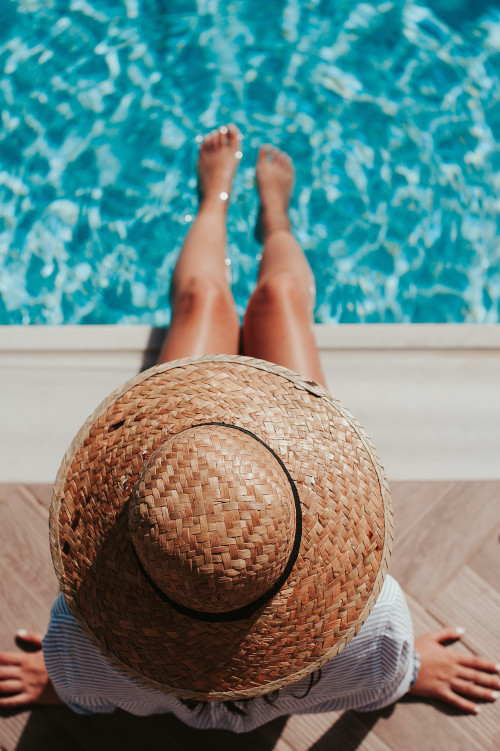 Ariel view Girl with Hat Poolside